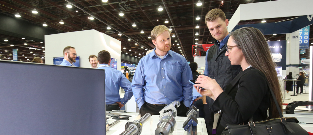 Trade show attendees viewing products at the Automate show
