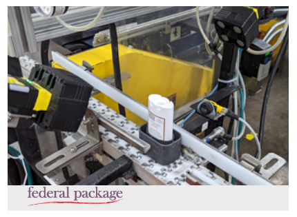 Federal Package camera reading label on deodorant item on production line