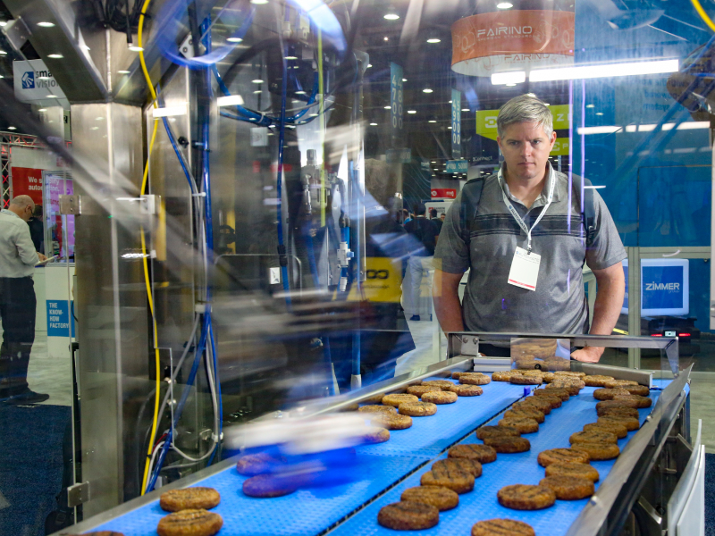 An Automate attendee watches an industrial food application come to life.